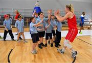 27 June 2018; Stine Austgulen of Norway celebrates with children from Scartleigh National School, Saleen, Midleton, Co. Cork, after the FIBA 2018 Women's European Championships for Small Nations Group B match between Cyprus and Norway at the Mardyke Arena in Cork, Ireland. Photo by Brendan Moran/Sportsfile