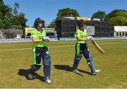 29 June 2018; Cecelia Joyce, left, and Clare Shillington of Ireland make their way to the wicket prior to the Women's T20 International match between Ireland and Bangladesh at Malahide Cricket Club Ground in Dublin. Photo by Seb Daly/Sportsfile