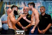 29 June 2018; Jono Carroll, left, and Declan Geraghty weigh in ahead of their Super Featherweight bout at the Europa Hotel in Belfast. Photo by Mark Marlow/Sportsfile
