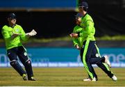 29 June 2018; George Dockrell of Ireland, right, is congratulated by team-mate Gary Wilson, left, after catching out Virat Kohli of India during the T20 International match between Ireland and India at Malahide Cricket Club Ground in Dublin. Photo by Seb Daly/Sportsfile