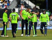 29 June 2018; Paul Stirling of Ireland, second right, is congratulated by team-mate Kevin O'Brien after claiming the wicket of Rohit Sharma of India during the T20 International match between Ireland and India at Malahide Cricket Club Ground in Dublin. Photo by Seb Daly/Sportsfile