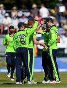 29 June 2018; George Dockrell of Ireland, right, is congratulated by team-mates after catching out Suresh Raina of India during the T20 International match between Ireland and India at Malahide Cricket Club Ground in Dublin. Photo by Seb Daly/Sportsfile