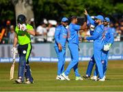 29 June 2018; Umesh Yadav of India, centre, is congratulated by team-mates after bowling out William Porterfield of Ireland, left, during the T20 International match between Ireland and India at Malahide Cricket Club Ground in Dublin. Photo by Seb Daly/Sportsfile