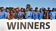 29 June 2018; India players and staff celebrate with the trophy following the T20 International match between Ireland and India at Malahide Cricket Club Ground in Dublin. Photo by Seb Daly/Sportsfile