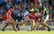 29 June 2018; Liam O’Donovan of Cork, supported by team-mate Kevin O’Donovan, left, in action against Bryan Sweeney, centre, and David Shaw of Kerry during the EirGrid Munster GAA Football U20 Championship Final match between Kerry and Cork at Austin Stack Park in Tralee, Kerry. Photo by Piaras Ó Mídheach/Sportsfile