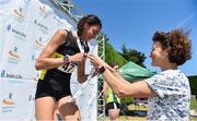 30 June 2018; Sophie O'Sullivan of Ballymore Cobh A.C., Co. Cork, is presented with her silver medal by her mother, Sonia O'Sullivan, after competing in the Junior Women 800m event   during the Irish Life Health National Junior & U23 T&F Championships at Tullamore Harriers Stadium in Tullamore, Offaly. Photo by Sam Barnes/Sportsfile