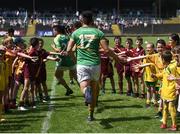 30 June 2018; Domhnaill Flynn of Leitrim is welcomed onto the field by local children ahead of the GAA Football All-Ireland Senior Championship Round 3 match between Leitrim and Monaghan at Páirc Seán Mac Diarmada in Carrick-on-Shannon, Leitrim. Photo by Daire Brennan/Sportsfile