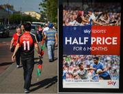 30 June 2018; Supporters walk past an advertisement for Sky Sports on their way to St Conleth's Park prior to the GAA Football All-Ireland Senior Championship Round 3 match between Kildare and Mayo at St Conleth's Park in Newbridge, Kildare. Photo by Stephen McCarthy/Sportsfile