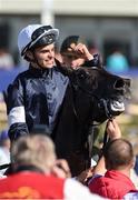 30 June 2018; Jockey Donnacha O'Brien makes his way to the winner's enclosure after winning the Dubai Duty Free Irish Derby on Latrobe during day 2 of the Dubai Duty Free Irish Derby Festival at the Curragh Racecourse in Kildare. Photo by Matt Browne/Sportsfile