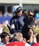 30 June 2018; Jockey Donnacha O'Brien makes his way to the winner's enclosure after winning the Dubai Duty Free Irish Derby on Latrobe during day 2 of the Dubai Duty Free Irish Derby Festival at the Curragh Racecourse in Kildare. Photo by Matt Browne/Sportsfile