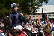 30 June 2018; Jockey Donnacha O'Brien makes his way to the winner's enclosure after winning the Dubai Duty Free Irish Derby on Latrobe during day 2 of the Dubai Duty Free Irish Derby Festival at the Curragh Racecourse in Kildare. Photo by Matt Browne/Sportsfile