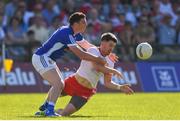 30 June 2018; Matthew Donnelly of Tyrone is tackled by Sean McCormack of Cavan during the GAA Football All-Ireland Senior Championship Round 3 match between Cavan and Tyrone at Brewster Park in Enniskillen, Fermanagh. Photo by Eóin Noonan/Sportsfile