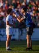 30 June 2018; Kildare physiotherapist Rob McCabe works with Chris Healy of Kildare during the GAA Football All-Ireland Senior Championship Round 3 match between Kildare and Mayo at St Conleth's Park in Newbridge, Kildare. Photo by Stephen McCarthy/Sportsfile