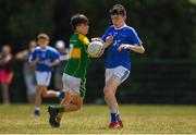 1 July 2018; Eoghan Hassett of Laune Rangers, Co. Kerry, in action against Jake Buckley of Claregalway during the John West Féile Peil na nÓg National Competitions 2018 match between Claregalway and Laune Rangers at Stamullen GAA in Meath. This is the third year that the Féile na nGael and Féile Peile na nÓg have been sponsored by John West, one of the world’s leading suppliers of fish. The competition gives up-and-coming GAA superstars the chance to participate and play in their respective Féile tournament, at a level which suits their age, skills and strengths. Photo by Harry Murphy/Sportsfile