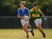 1 July 2018; Joseph Cronin Langham of Laune Rangers, Co. Kerry, in action against Luc O'Conor of Claregalway during the John West Féile Peil na nÓg National Competitions 2018 match between Claregalway and Laune Rangers at Stamullen GAA in Meath. This is the third year that the Féile na nGael and Féile Peile na nÓg have been sponsored by John West, one of the world’s leading suppliers of fish. The competition gives up-and-coming GAA superstars the chance to participate and play in their respective Féile tournament, at a level which suits their age, skills and strengths. Photo by Harry Murphy/Sportsfile