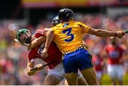 1 July 2018; Seamus Harnedy of Cork is tackled by David McInerney of Clare during the Munster GAA Hurling Senior Championship Final match between Cork and Clare at Semple Stadium in Thurles, Tipperary. Photo by Eóin Noonan/Sportsfile
