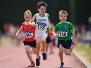 1 July 2018; Athletes, from left, Fionn Kirby of Kildare A.C., Co. Kildare, Calum McMahon of Craughwell A.C., Co. Galway and Eanna McGrath of Tuam A.C., Co. Galway, competing in the U9 Boys 300m event during the Irish Life Health Juvenile Games & Inter Club Relays at Tullamore Harriers Stadium in Tullamore, Offaly. Photo by Sam Barnes/Sportsfile