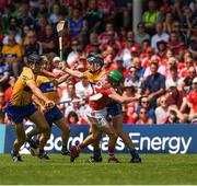 1 July 2018; Seamus Harnedy of Cork is tackled by David McInerney of Clare during the Munster GAA Hurling Senior Championship Final match between Cork and Clare at Semple Stadium in Thurles, Tipperary. Photo by Ray McManus/Sportsfile