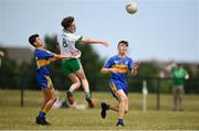 1 July 2018; Michael Murdock of Burren GAC in action against Chris Haskins, left, and Liam Kelly of Ratoath during the John West Féile Peil na nÓg National Competitions 2018 match between Ratoath and Burren GAC at Stamullen GAA in Meath. This is the third year that the Féile na nGael and Féile Peile na nÓg have been sponsored by John West, one of the world’s leading suppliers of fish. The competition gives up-and-coming GAA superstars the chance to participate and play in their respective Féile tournament, at a level which suits their age, skills and strengths. Photo by Harry Murphy/Sportsfile