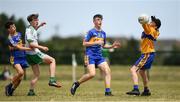 1 July 2018; Michael Murdock of Burren GAC in action against Chris Haskins, left, Liam Kelly, centre, and Tim Fitzpatrick of Ratoath during the John West Féile Peil na nÓg National Competitions 2018 match between Ratoath and Burren GAC at Stamullen GAA in Meath. This is the third year that the Féile na nGael and Féile Peile na nÓg have been sponsored by John West, one of the world’s leading suppliers of fish. The competition gives up-and-coming GAA superstars the chance to participate and play in their respective Féile tournament, at a level which suits their age, skills and strengths. Photo by Harry Murphy/Sportsfile