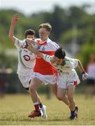 1 July 2018; John Lavery of ODonovan Rossa GAC in action against Rory McCormack, left, and Ian Kavanagh of New York during the John West Féile Peil na nÓg National Competitions 2018 match between ODonovan Rossa GAC and New York at Stamullen GAA in Meath. This is the third year that the Féile na nGael and Féile Peile na nÓg have been sponsored by John West, one of the world’s leading suppliers of fish. The competition gives up-and-coming GAA superstars the chance to participate and play in their respective Féile tournament, at a level which suits their age, skills and strengths. Photo by Harry Murphy/Sportsfile