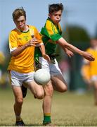 1 July 2018; Adam Fegan of Clonduff GAC in action against Gerard O Riordan of Claregalway during the John West Féile Peil na nÓg National Competitions 2018 match between Claregalway and Clonduff GAC at Stamullen GAA in Meath. This is the third year that the Féile na nGael and Féile Peile na nÓg have been sponsored by John West, one of the world’s leading suppliers of fish. The competition gives up-and-coming GAA superstars the chance to participate and play in their respective Féile tournament, at a level which suits their age, skills and strengths. Photo by Harry Murphy/Sportsfile