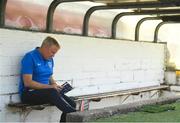 2 July 2018; Portsouth manager Kenny Jackett reads the match programme prior to the pre-season friendly match between Cork City and Portsmouth at Turners Cross in Cork. Photo by Harry Murphy/Sportsfile