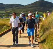 4 July 2018; Rory McIlroy, right, of Northern Ireland and former jockey AP McCoy during the Pro-Am round ahead of the Irish Open Golf Championship at Ballyliffin Golf Club in Ballyliffin, Co Donegal. Photo by Ramsey Cardy/Sportsfile