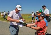 4 July 2018; Paul Dunne of Ireland signing autographs on the 10th tee during the Pro-Am round ahead of the Irish Open Golf Championship at Ballyliffin Golf Club in Ballyliffin, Co. Donegal. Photo by Oliver McVeigh/Sportsfile