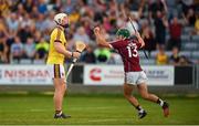 4 July 2018; Evan Niland of Galway celebrates scoring his side's third goal as Arraon Maddock of Wexford looks dejected during the Bord Gais Energy Leinster Under 21 Hurling Championship 2018 Final match between Wexford and Galway at O'Moore Park in Portlaoise, Co Laois. Photo by Harry Murphy/Sportsfile