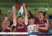 4 July 2018; Galway captain Fintan Burke lifts the trophy after with teammates Darragh Gilligan, centre, and Jack Fitzpatrick after the Bord Gais Energy Leinster Under 21 Hurling Championship 2018 Final match between Wexford and Galway at O'Moore Park in Portlaoise, Co Laois. Photo by Harry Murphy/Sportsfile