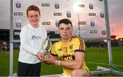 4 July 2018; Daniel Jordan, aged 7, from Oranmore, Co.Galway presents Rory O'Connor of Wexford with his Bord Gáis Energy Man of the Match award following the meeting of Wexford and Galway in the Bord Gáis Energy GAA Hurling U21 Munster Championship Final at O’Moore Park, Portlaoise. Bord Gáis Energy offers its customers unmissable rewards throughout the Championship season, including match tickets and hospitality, access to training camps with Hurling stars and the opportunity to present Man of the Match Awards at U21 games. Photo by Harry Murphy/Sportsfile