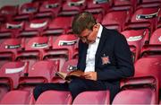 6 July 2018; Dundalk manager Stephen Kenny reads the match programme prior to the SSE Airtricity League Premier Division match between St Patrick's Athletic and Dundalk at Richmond Park in Dublin. Photo by Stephen McCarthy/Sportsfile