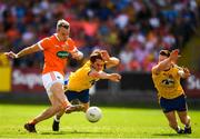 7 July 2018; Mark Shields of Armagh scores his side's first goal despite the attention of David Murray and Seán McDermott of Roscommon during the GAA Football All-Ireland Senior Championship Round 4 match between Roscommon and Armagh at O’Moore Park in Portlaoise, Co. Laois. Photo by Eóin Noonan/Sportsfile