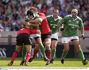 16 August 2003; David Humphreys of Ireland, is tackled by Dwayne Peel and Rhys Oakley of Wales during the Permanent TSB test between Ireland and Wales at Lansdowne Road, Dublin. Photo by Brendan Moran/Sportsfile