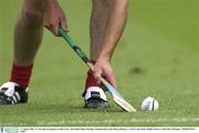 17 August 2003; A Cork player prepares to take a free during the All-Ireland Minor Hurling Championship Semi-Final between Kilkenny and Cork at Croke Park in Dublin. Photo by Ray McManus/Sportsfile