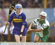 23 August 2003; Deirdre Hughes of Tipperary, in action against Limerick's Claire Mulcahy during the Foras na Gaeilge All-Ireland Senior Camogie Championship Semi-Final between Tipperary and Limerick at Cusack Park, Ennis. Photo by Ray McManus/Sportsfile