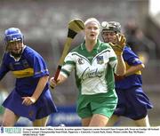 23 August 2003; Rose Collins of Limerick, in action against Tipperary corner forward Clare Grogan, left during the Foras na Gaeilge All-Ireland Senior Camogie Championship Semi-Final between Tipperary and Limerick at Cusack Park, Ennis. Photo by Ray McManus/Sportsfile