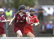 23 August 2003; Lorraine Lally of Galway, in action against Cork's Una O'Donoghue during the Foras na Gaeilge All-Ireland Senior Camogie Championship Semi-Final between Galway and Cork at Cusack Park, Ennis. Photo by Ray McManus/Sportsfile