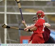 23 August 2003; Fiona O'Driscoll of Cork, scores a point under pressure from Galway 'keeper Louise Curry, during the Foras na Gaeilge All-Ireland Senior Camogie Championship Semi-Final between Galway and Cork at Cusack Park, Ennis. Photo by Ray McManus/Sportsfile