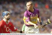 16 August 2003; Larry Murphy, Wexford, in action against Cork's Ronan Curran during the Guinness All-Ireland Senior Hurling Championship Semi-Final replay between Cork and Wexford at Croke Park, Dublin. Photo by Damien Eagers/Sportsfile
