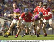 16 August 2003; Ronan Curran, Cork, in action against Wexford's Rory Jacob during the Guinness All-Ireland Senior Hurling Championship Semi-Final replay between Cork and Wexford at Croke Park, Dublin. Photo by Damien Eagers/Sportsfile