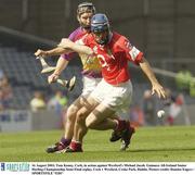 16 August 2003; Tom Kenny, Cork, in action against Wexford's Michael Jacob during the Guinness All-Ireland Senior Hurling Championship Semi-Final replay between Cork and Wexford at Croke Park, Dublin. Photo by Damien Eagers/Sportsfile