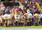 16 August 2003; Members of the Wexford team pull their socks down after the pre match parade at the Guinness All-Ireland Senior Hurling Championship Semi-Final replay between Cork and Wexford at Croke Park, Dublin. Photo by Damien Eagers/Sportsfile
