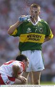 24 August 2003; Brian Dooher of Tyrone, looks on as Marc O'Se of Kerry takes a drink during the Bank of Ireland All-Ireland Senior Football Championship Semi-Final between Tyrone and Kerry at Croke Park in Dublin. Photo by Damien Eagers/Sportsfile