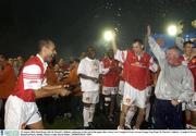 25 August 2003; Paul Osam, left, of St. Patrick's Athletic, celebrates at the end of the game with teammates and manager Eamonn Collins, after victory over Longford Town in the Eircom League Cup Final between St. Patrick's Athletic and Longford Town at Richmond Park, Dublin. Photo by David Maher/Sportsfile