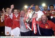 25 August 2003; St. Patrick's Athletic manager Eamon Collins, third from left, celebrates with players and staff at the end of the game after victory over Longford Town after the eircom League Cup Final between St. Patrick's Athletic and Longford Town at Richmond Park, Dublin. Photo by David Maher/Sportsfile