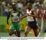 25 August 2003; Darren Campbell of Great Britain, right, crosses the line to win a bronze medal in the Men's 100m Final during the third day's competition. 9th IAAF World Championships in Athletics at Stade de France, Paris, France. Photo by Brendan Moran/Sportsfile