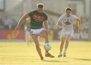 30 June 2018; Aidan O’Shea of Mayo passes under pressure from David Hyland of Kildare during the GAA Football All-Ireland Senior Championship Round 3 match between Kildare and Mayo at St Conleth's Park in Newbridge, Kildare. Photo by Piaras Ó Mídheach/Sportsfile