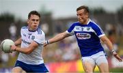 8 July 2018; Niall Kearns of Monaghan is tackled by Kieran Lillis of Laois during the GAA Football All-Ireland Senior Championship Round 4 match between Laois and Monaghan at Páirc Tailteann in Navan, Co Meath. Photo by Ramsey Cardy/Sportsfile